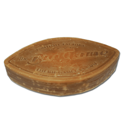 Brown oval soap bar with embossed branding on the top surface.