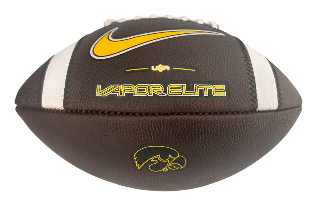 Brown leather football with white stripes and laces, featuring a yellow Nike swoosh and the 'Vapor Elite' branding.