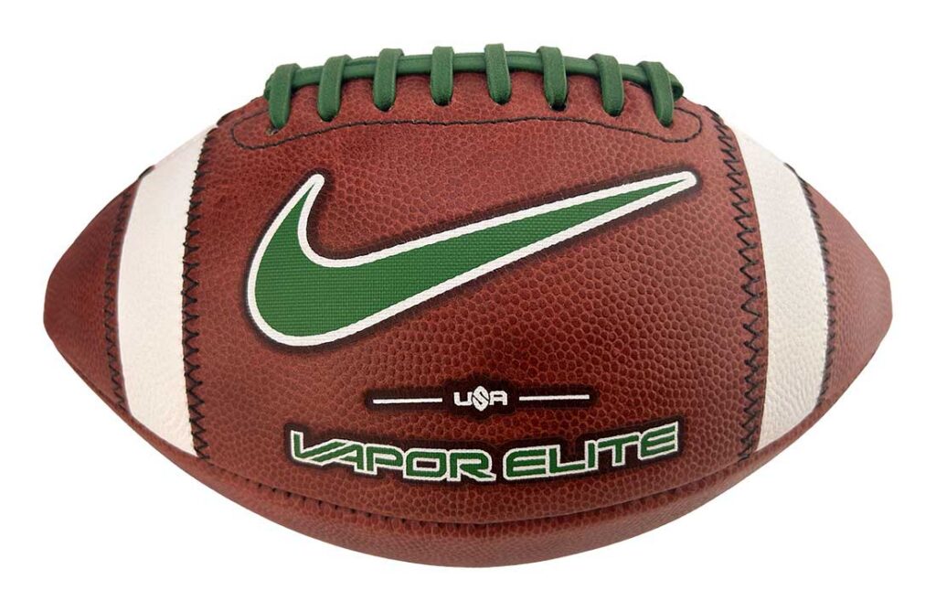 Brown leather football with green laces and a green Nike swoosh logo; Vapor Elite branding visible, close-up view.