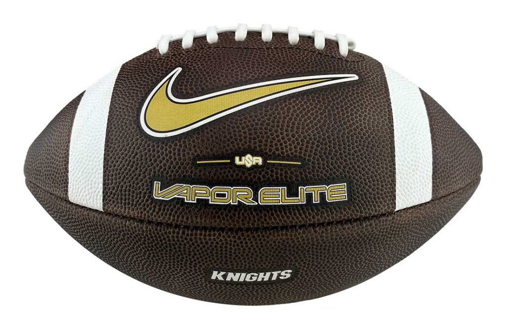 Official Vapor Elite football: brown leather with white laces, gold Nike swoosh, Knights branding on the side.