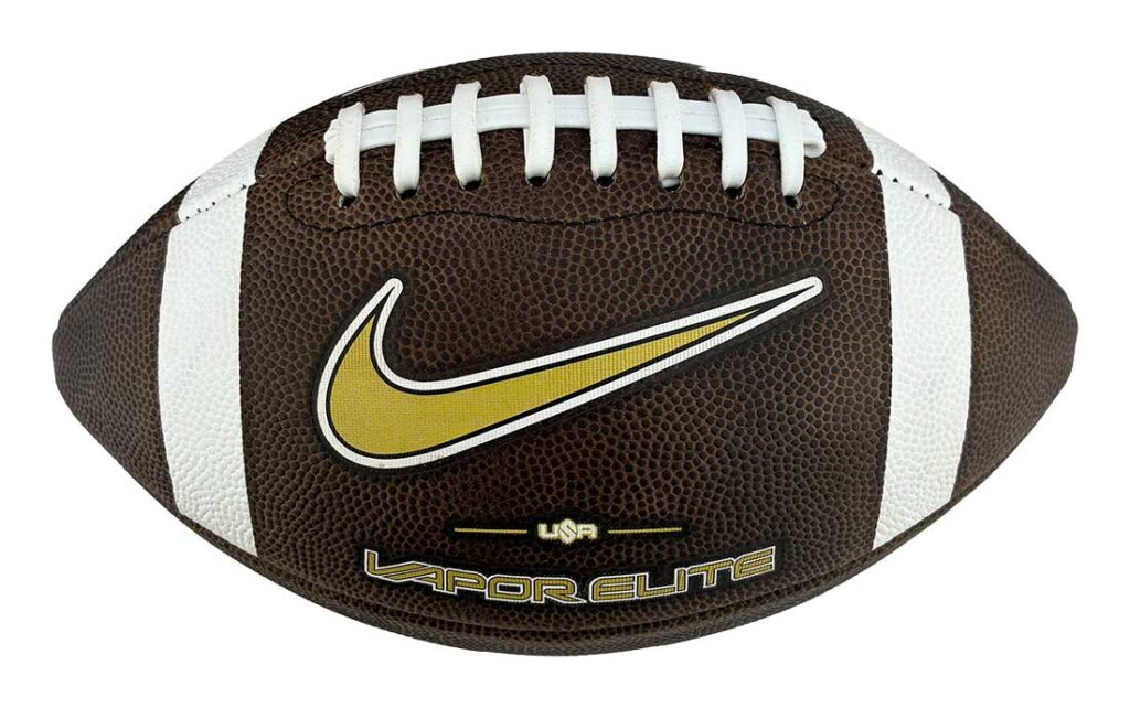 Brown leather American football with white laces and white stripes, featuring a gold Nike swoosh and USA/LAPOR ELITE branding.