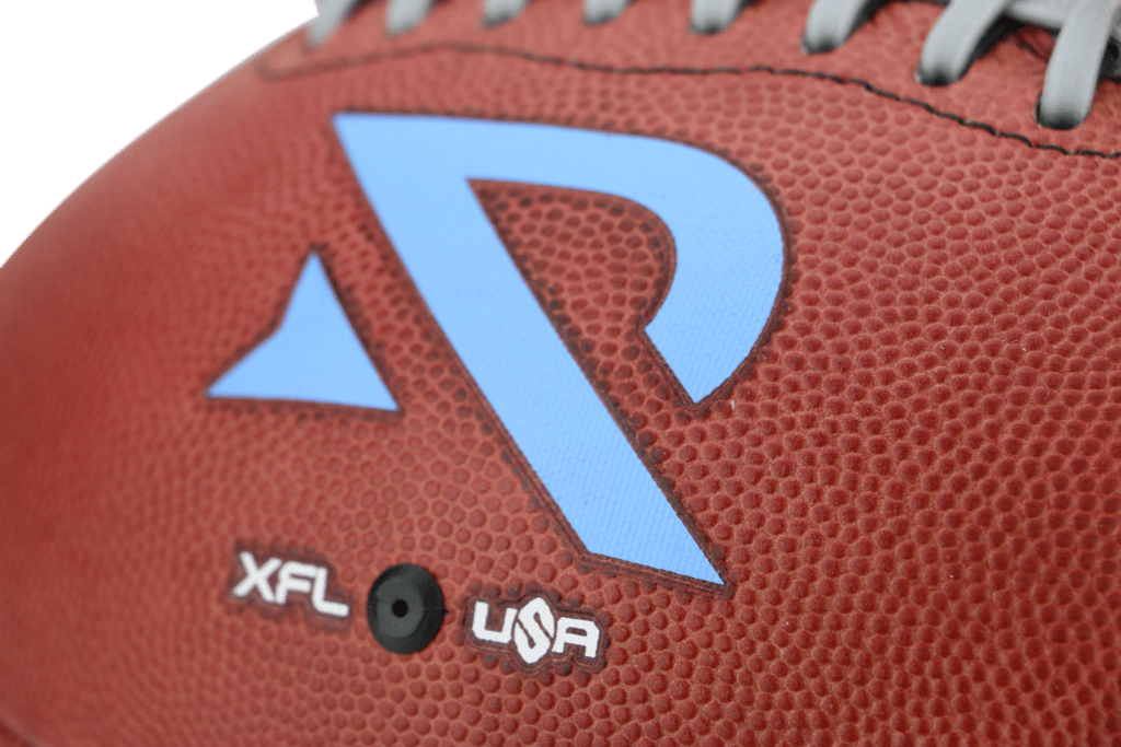 Close up of blue Arlington Renegades logo on football for XFL