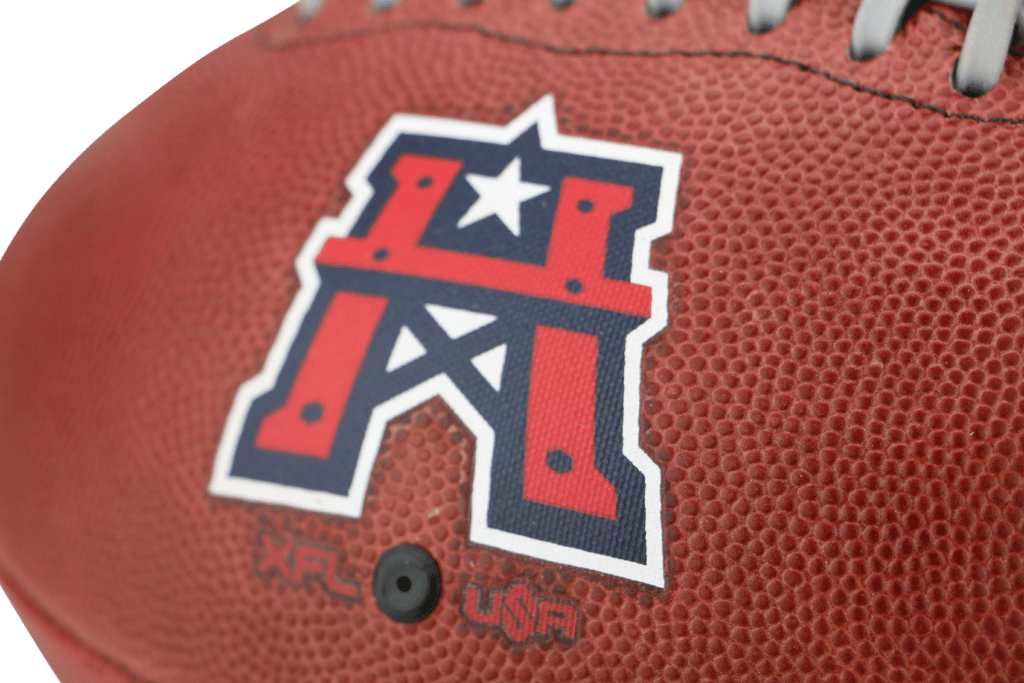 Close up of red and white Houston Roughnecks logo on football for XFL