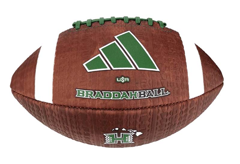 Brown football with green and white branding reading 'BRADDAH BALL' and a large green geometric logo, set against a white background and lace detail at the top.