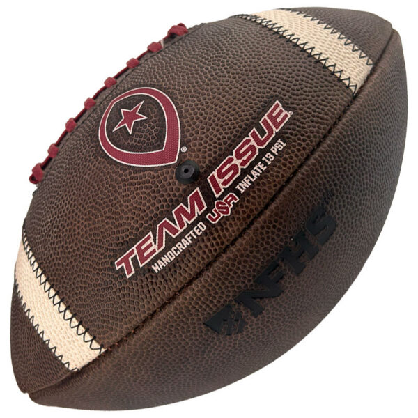 Brown leather American football with red laces and TEAM ISSUE branding on the side, close-up detail of the pebble texture and stitching, white stripes at the seams.
