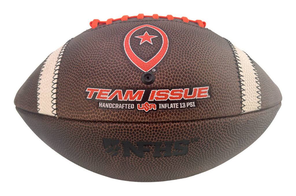 Brown pebble-grain football with orange laces and white stripes, branded 'TEAM ISSUE' with 'Handcrafted USA Inflate 13 PSI' text.