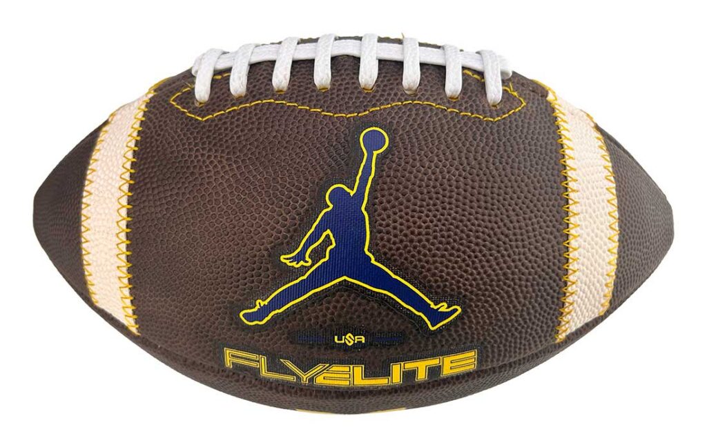 Brown American football with white laces and yellow stitching, featuring a blue Jumpman logo and 'FLYELITE' branding.