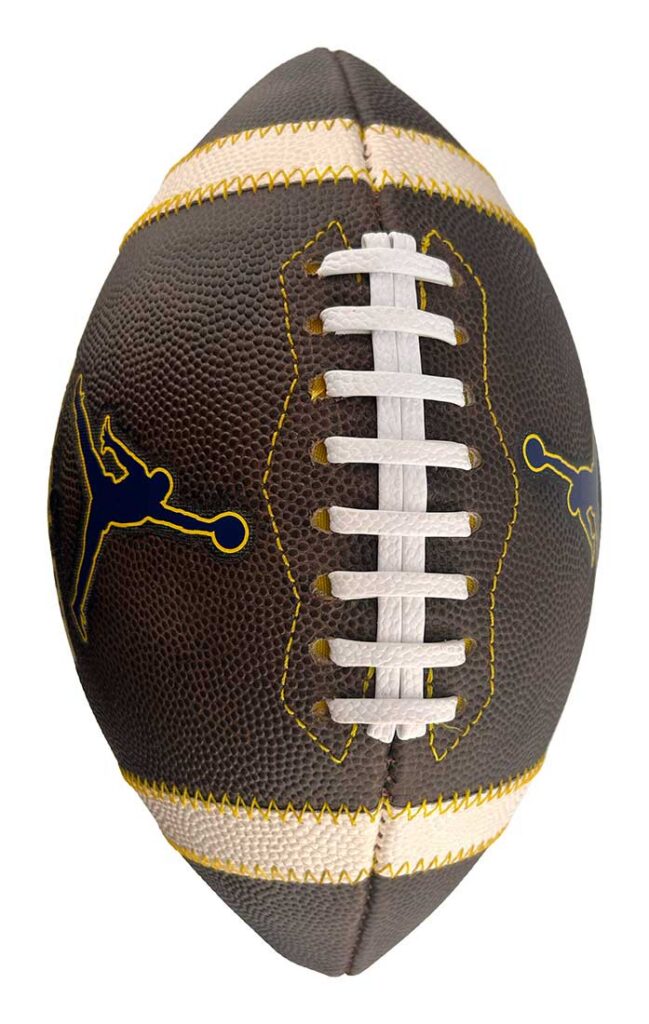 Brown leather football with white laces and yellow stitching, featuring Jumpman logos on the sides.
