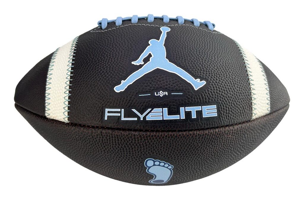 Black football with light-blue laces and side stripes, featuring the Jumpman logo, the word 'FLYELITE', and a small blue footprint graphic.