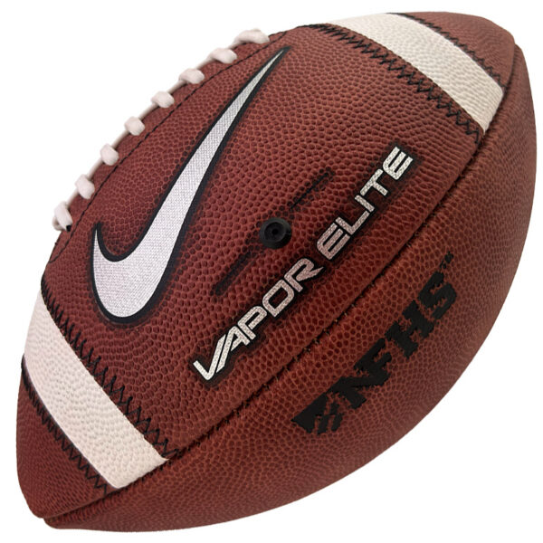 Close-up of a brown Nike Vapor Elite football with white laces, white stripes, and branding visible on the surface.
