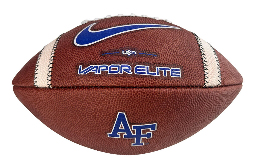 American football with blue AF logo, Nike swoosh, and 'VAPOR ELITE' branding on brown leather surface