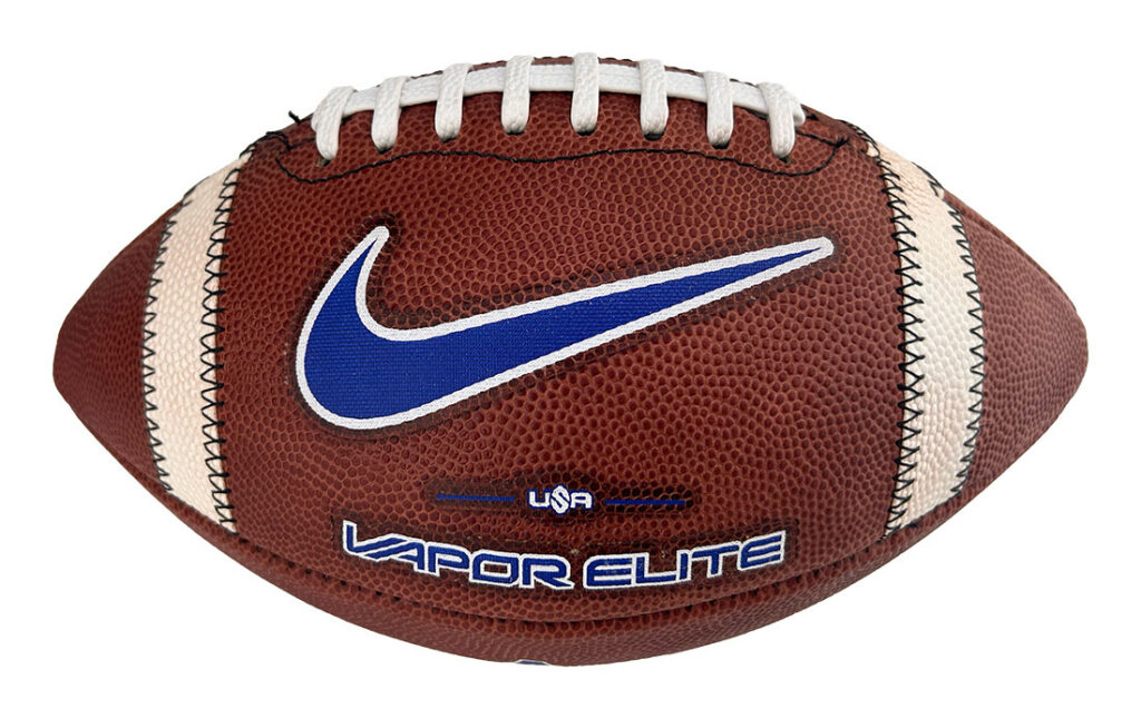 Nike Vapor Elite football: brown leather with white laces, blue swoosh, and USA/Vapor Elite branding on the panel.