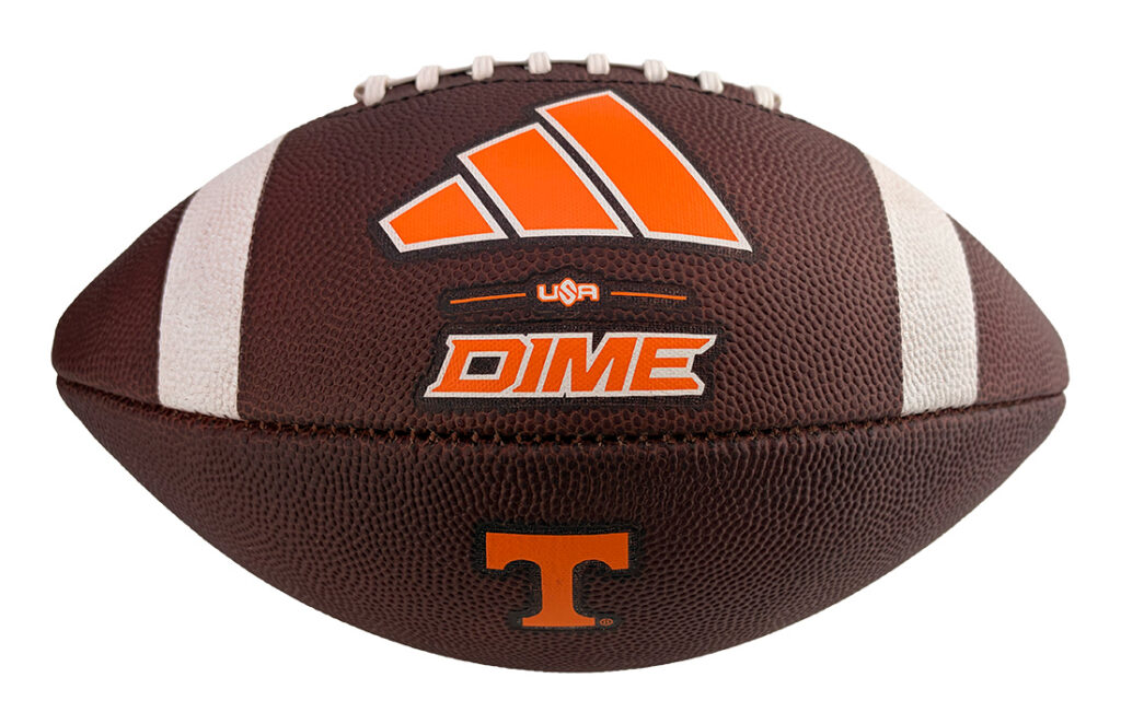 Brown leather football with white laces and orange branding, including a large orange striped logo, 'DIME' text, a small 'USA' mark, and a Tennessee 'T' emblem on the panel.