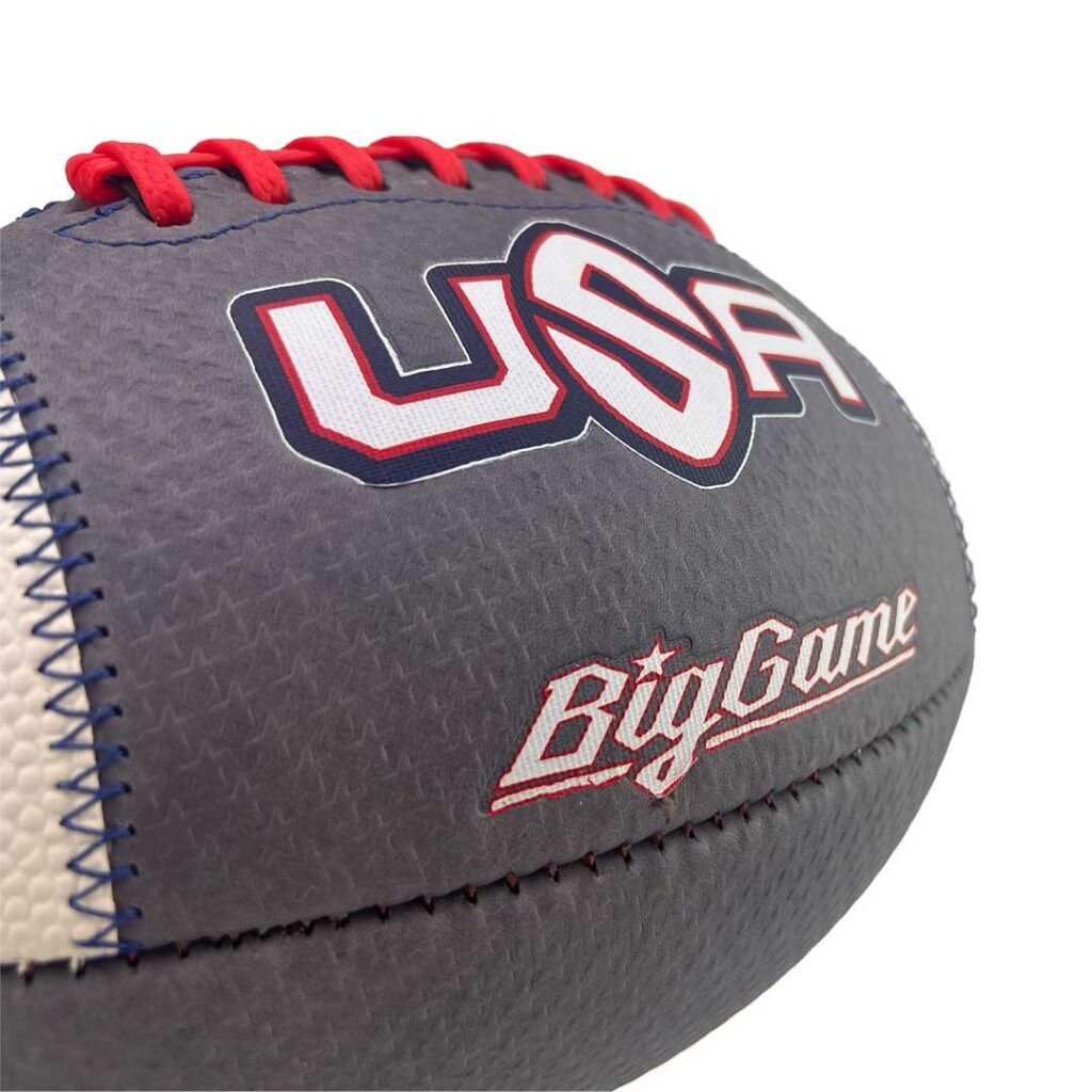 Close-up of a gray baseball with red stitching and bold 'USA' logo and 'BigGame' text on the side.