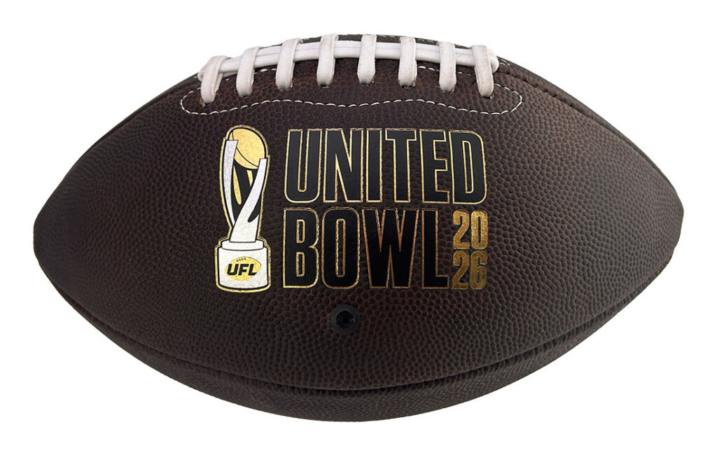 Brown leather football with white laces featuring a gold United Bowl 2026 logo and UF L emblem on the side.