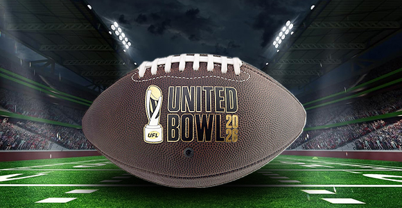 Football with the United Bowl 2026 logo centered on a bright stadium field at night