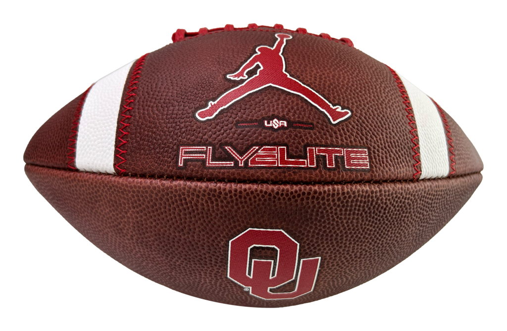 Close-up of a brown basketball featuring a red Jumpman logo and the word 'FLYELITE' stitched in red on white seams.