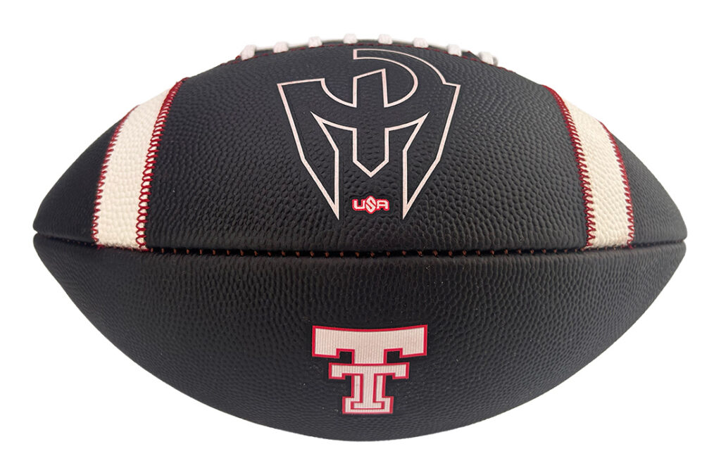 Black American football with white laces and red/cream stripe accents, showing large center logo and a small emblem below.